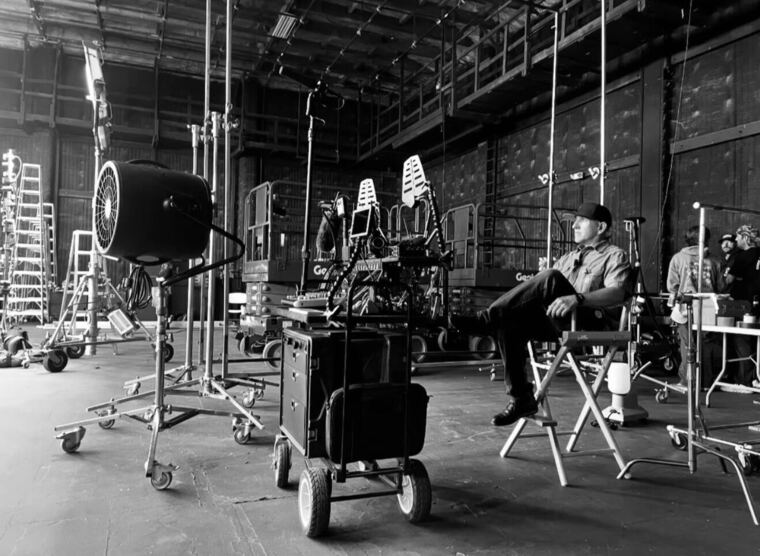 Luis Martinez on set beside his prop cart